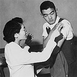 Evacuees of Japanese descent being inoculated as they registered for evacuation