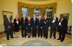 President George W. Bush stands with the recipients of the 2002 National Humanities Medal in the Oval Office Thursday, Feb. 27, 2003. From left, they are: Joseph McDade, who accepts the award on behalf of Frankie Hewitt of Ford's Theatre; Ellen Carroll Walton, who accepts the award on behalf of the Mount Vernon Ladies' Association of the Union; Dr. Donald Kagan of Yale University; author Patricia MacLachlan; Brian Lamb of C-SPAN; Art Linkletter of the United Seniors Association; Frank Conroy, who accepts the award on behalf of the Iowa Writers' Workshop; and Justice Clarence Thomas, who accepts the award on behalf of Dr. Thomas Sowell of the Hoover Institution.  White House photo by Paul Morse