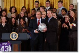 President George W. Bush poses with Andy Groom, captain of Ohio State University's football team, during a visit to the White House by the NCAA Fall Champions Monday, Feb. 24, 2003.   White House photo by Tina Hager