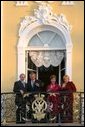 President George W. Bush and Mrs. Laura Bush wave with Russian President Vladimir Putin and wife Lyudmila Putin from the window of Peterhof Palace in St. Petersburg, Russia May 31, 2003. They were taking part in St. Petersburg's 300th anniversary celebration. White House photo by Paul Morse