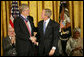 President George W. Bush awards the Presidential Medal of Freedom to physician Francis S. Collins, director of the National Human Genome Research Institute, in the East Room Nov. 5, 2007. White House photo by Eric Draper