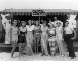 Photo:  women  at the beach, modeling summer beach attire .