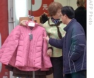 Customers shop for clothes at store in Taipei (file photo)