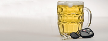 a mug of beer and a set of car keys