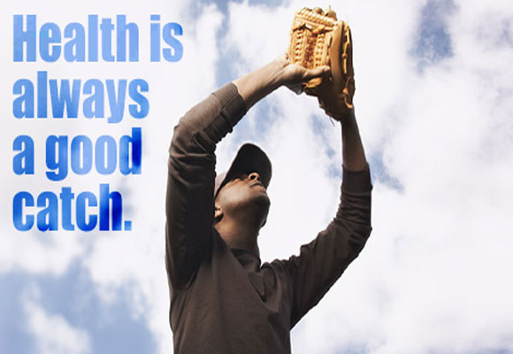 Cover Image: A man outside with a baseball glove trying to catch a baseball. Cover Text: Health is always a good catch. Inside text: Take daily steps to live a healthier life. Learn more about men's health (link to http://www.cdc.gov/men/tips/).