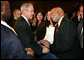 President George W. Bush greets an audience member after delivering remarks on trade policy Friday, Oct. 12, 2007, at the Radisson Miami Hotel in Miami. White House photo by Eric Draper