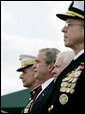 President George W. Bush attends an Armed Forces farewell tribute in honor of U.S. Marine General Peter Pace, left, and Armed Forces hail in honor of Navy Admiral Michael Mullen, right, joined by Secretary of Defense Robert Gates, Monday, October 1, 2007 at Fort Myer, Va. General Pace is retiring after serving two years as Chairman and four years as Vice Chairman of the Joint Chiefs of Staff. White House photo by Eric Draper