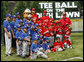 Teams participating in the opening game of the 2008 Tee Ball on the South Lawn, the Cramer Hill Little League Red Sox of Camden, N.J., and the Jose M. Rodriguez Little League Angels of Manati, Puerto Rico, pose together Monday, June 30, 2008, for a photo on the South Lawn of the White House. White House photo by Eric Draper