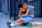 Image of female couple sitting and using their PDA.