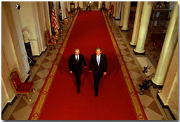 President George W. Bush and Russian President Vladimir Putin walk out to address the media at the White House Nov. 13. "This is a new day in the long history of Russian-American relations, a day of progress and a day of hope," said President Bush in his remarks. White House photo by Paul Morse.