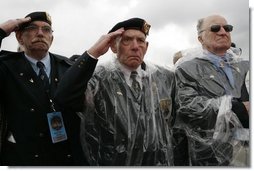 Veterans of World War II salute President George W. Bush Sunday, May 8, 2005, during a celebration at the Netherlands American Cemetery in Margraten, Netherlands, honoring those who served 60 years ago.  White House photo by Krisanne Johnson