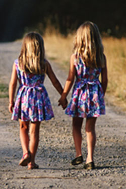 two girls walking hand in hand