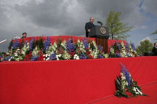 President George W. Bush addresses attendees Sunday, May 8, 2005, at Netherlands American Cemetery in Margraten, during a celebration in remembrance of those who served in World War II. White House photo by Eric Draper