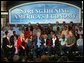 President George W. Bush leads the on stage discussion during a conversation on the economy with employees at Nu-Air Manufacturing Company in Tampa, Florida, Monday, Feb. 16, 2004. White House photo by Eric Draper