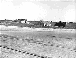 Migrants' tents are a common sight along the right of way of the southern pacific. Near Fresno, California.