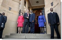 President George W. Bush and Laura Bush are welcomed to the Union House in Pretoria, South Africa, by South African President Thabo Mbeki and Zanele Mbeki Wednesday, July 9, 2003.  White House photo by Paul Morse