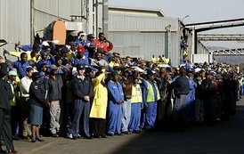 Workers at the Ford Motor Company plant watch as President Bush departs the plant near Pretoria, South Africa, Wednesday July 9, 2003.  White House photo by Paul Morse