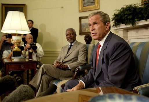 President George W. Bush and United Nations Secretary General Kofi Annan talk with the media during a meeting in the Oval Office Monday, July 14, 2003. They discussed President Bush's recent trip to Africa, and issues concerning Liberia and Iraq. White House photo by Paul Morse.