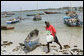 Fishing boats sit at the ready on the beach adjacent to the fish market, Monday, February 18, 2008 in the Tanzanian capitol of Dar es Salaam. White House photo by Chris Greenberg