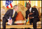 President George W. Bush speaks with Ghana President John Agyekum Kufuor during their meeting at Osu Castle, Wednesday, Feb. 20, 2008 in Accra, Ghana. White House photo by Eric Draper