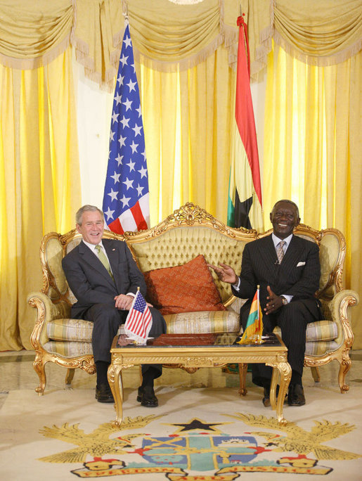 President George W. Bush and Ghana President John Agyekum Kufuor laugh together during their meeting at Osu Castle, Wednesday, Feb. 20, 2008 in Accra, Ghana. White House photo by Eric Draper
