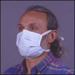 Photo: Man wearing a surgical mask