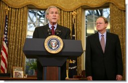 With Michael McConnell, Director of National Intelligence, looking on, President George W. Bush delivers a statement on the Protect America Act Wednesday, Feb. 13, 2008, in the Oval Office of the White House. Said the President, "It is time for Congress to ensure the flow of vital intelligence is not disrupted. It is time for Congress to pass a law that provides a long-term foundation to protect our country. And they must do so immediately."  White House photo by Joyce N. Boghosian