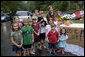 Mrs. Laura Bush stops and poses with children at their lemonade stand during her visit to Raleigh, N.C., Friday, October 10, 2008. White House photo by Chris Greenberg