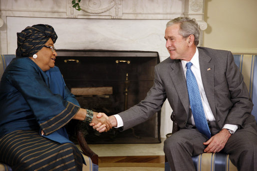 President George W. Bush shakes hands with Liberia President Ellen Johnson Sirleaf following their meeting Wednesday, Oct. 22, 2008, in the Oval Office at the White House. President Bush said to President Sirleaf, "I have come to respect you and admire you because of your courage, your vision, your commitment to universal values and principles." White House photo by Eric Draper