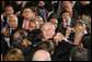 President George W. Bush reaches into the audience to shake hands after signing H.R. 7081, The United States-India Nuclear Cooperation Approval and Nonproliferation Enhancement Act, Wednesday, Oct. 8, 2008, in the East Room at the White House. White House photo by Chris Greenberg