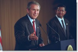 President George W. Bush and El Salvador's President Francisco Flores (right) hold a joint press conference in San Salvador, El Salvador, March 24, 2002. "El Salvador is one of the really great stories of economic and political transformation of our time. Just over a decade ago, this country was in civil war," said the President in his remarks. "The country has renewed its commitment to democracy and economic reform and trade. It is one of the freest and strongest and most stable countries in our hemisphere." White House photo by Eric Draper.