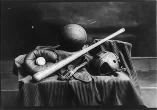 Athletic equipment. Bat, baseball, mitt, basketball, helmet, and spiked shoes. National Photo Co. 1941