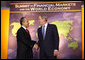 President George W. Bush welcomes Mexico's President Felipe Calderon to the Summit on Financial Markets and the World Economy Saturday, Nov. 15, 2008, at the National Building Museum in Washington, D.C. White House photo by Chris Greenberg