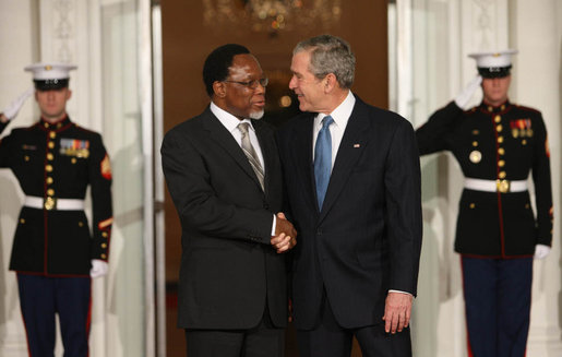 President George W. Bush welcomes President Kgalema Motlanthe of South Africa to the White House Friday, Nov. 14, 2008, for the dinner marking the opening of the Summit on Financial Markets and World Economy. White House photo by Chris Greenberg