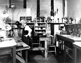 WPA photographer, Mr. Prater, in project darkroom, on the campus of the University of California, Berkeley.