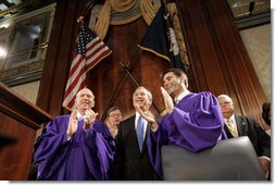 President George W. Bush is greeted to applause as he prepares to address legislators about Social Security at the State House in Columbia, S.C., Monday, April 18, 2005.  White House photo by Paul Morse