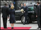 President George W. Bush carries a bouquet of flowers on his arrival to meet President Viktor Yushchenko of Ukraine, and his wife, Mrs. Kateryna Yushchenko Tuesday, April 1, 2008, at the Presidential Secretariat in Kyiv for their welcoming ceremony. White House photo by Chris Greenberg