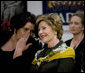 Mrs. Laura Bush watches the Lado National Fold Dance Ensemble performance, Saturday, April 5, 2008 in Zagreb, with the wife of the Prime Minister, Mrs. Mirjana Sanader. White House photo by Shealah Craighead