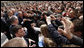 President George W. Bush reaches out to the crowd Saturday during his visit to St. Mark's Square in Zagreb. More than 3000 people were on hand to welcome the President during his visit. White House photo by Eric Draper