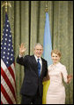 President George W. Bush and Ukraine Prime Minister Yuliya Tymoshenko wave to the media following their meeting Tuesday, April 1, 2008, at Kyiv's Club of Cabinet Ministers. White House photo by Eric Draper