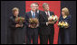 Carrying bowls of corn with candles, President George W. Bush and Mrs. Laura Bush and Ukraine President Viktor Yushchenko and Mrs. Kateryna Yushchenko visit the Holomodor Memorial in Kyiv Tuesday, April 1, 2008. The memorial honors victims of Ukraine's great famine of 1932. White House photo by Eric Draper