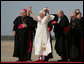 Pope Benedict XVI acknowledges the cheers of the crowd on his arrival to Andrews Air Force Base, Md., Tuesday, April 15, 2008, where he was greeted by President George W. Bush, Laura Bush and their daughter, Jenna. White House photo by Shealah Craighead