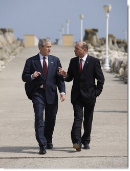 President George W. Bush and President Traian Basescu walk back from their joint press availability Wednesday on the grounds of the presidential retreat at Villas Neptun-Olimp in Neptun, Romania. White House photo by Eric Draper
