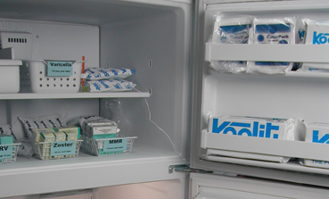 In the freezer, vaccine should be stored in the middle of the compartment, away from the walls, coils, and peripheral areas.