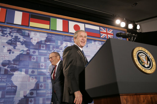 President George W. Bush stands at the podium after being introduced at the Freer Gallery in Washington D.C., Thursday, June 30, 2005, by Walter Stern, Chairman of the Board of Trustees, the Hudson Institute. The President spoke about his participation in the upcoming G8 Summit in Scotland, highlighting new initiatives to improve the quality of life of sub-Saharan Africans. White House photo by Paul Morse