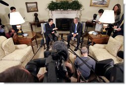 President George W. Bush and South Korean President Roh Moo-hyun talk with the press in the Oval Office Friday, June 10, 2005.  White House photo by Paul Morse