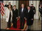 President George W. Bush and Mrs. Laura Bush welcome Jordan's King Abdullah II and Queen Rania upon their arrival to the White House for a social dinner Tuesday evening, March 6, 2007. White House photo by Paul Morse