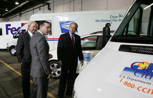 President George W. Bush and Secretary of Energy Sam Bodman listen to Mark Chernoby as the Vice President of Advance Vehicle Engineering at DaimlerChrysler describes the FedEx Pilot Program Plug-in Hybrid Sprinter during the President's visit Tuesday, March 27, 2007, to the U.S. Postal Service Vehicle Maintenance Facility in Washington, D.C. White House photo by Joyce Boghosian