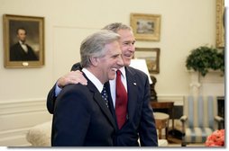 President George W. Bush and President Tabare Vazquez of Uruguay talk with the press in the Oval Office Thursday, May 4, 2006. White House photo by Eric Draper