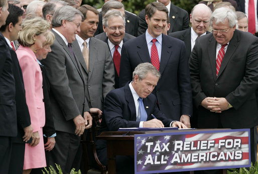 President George W. Bush signs H.R. 4297, the Tax Relief Extension Reconciliation Act of 2005, during bill-signing ceremonies Wednesday, May 17, 2006, on the South Lawn. White House photo by Paul Morse